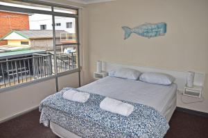 Postel nebo postele na pokoji v ubytování Wards Holiday Flat 5