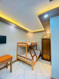 Μια τηλεόραση ή/και κέντρο ψυχαγωγίας στο Dos Casa Guest House +25 φωτογραφίες