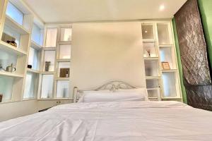 Letto o letti in una camera di h6市中心 唐人街 航站楼 风月街五房芭提雅海天-泳池别墅o