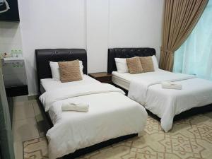 Postel nebo postele na pokoji v ubytování HASSMA Studio Apartment at Kompleks Mutiara GM + 10 fotografií