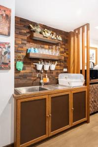 a kitchen with a sink and a counter at MIQ Rama9 Villa 3Br in City Jodd fair MRT in Makkasan +70 photos