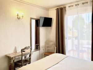 Postel nebo postele na pokoji v ubytování Hotel Lou Marquès