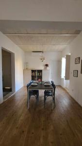 a large room with a table and two chairs at Kalkara Cozy 2 Bedroom Maisonette in Kalkara +19 photos
