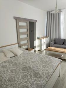 Ένα ή περισσότερα κρεβάτια σε δωμάτιο στο Apartament Forum Invest