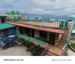 an overhead view of a house with a balcony at Rishop Mountain Homestay in Rishop