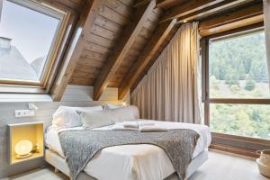 Postel nebo postele na pokoji v ubytování Luderna - Dúplex Val de Ruda C1 de Carlac