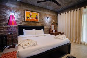 Postel nebo postele na pokoji v ubytování Aayu Hanthana Boutique Hotel
