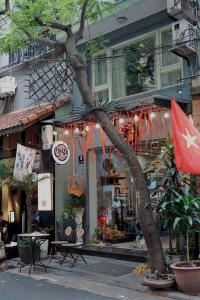 a store with a flag in front of a building at Cheers Hostel Hanoi in Hanoi +61 photos