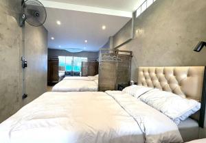 Ein Bett oder Betten in einem Zimmer der Unterkunft Nonoteru Chiangmai