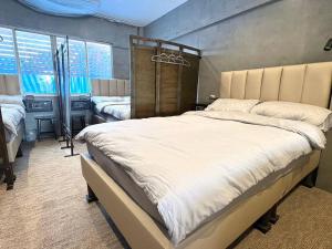 Ein Bett oder Betten in einem Zimmer der Unterkunft Nonoteru Chiangmai