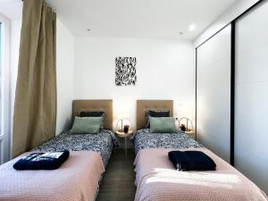 Ένα ή περισσότερα κρεβάτια σε δωμάτιο στο Madrid Private Rooms - Ferrer