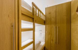 Łóżko lub łóżka w pokoju w obiekcie Bolodges Apartments by Alpin Rentals