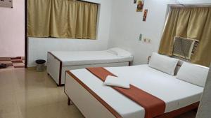 Postelja oz. postelje v sobi nastanitve Rajkumar GuestHouse