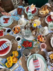 a table with plates of food on it at Villa Valentina in Levanto