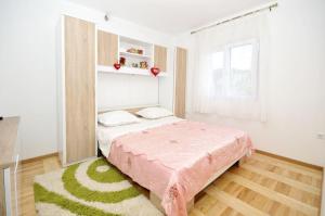 Posteľ alebo postele v izbe v ubytovaní Apartments Ivica