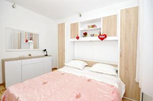 Posteľ alebo postele v izbe v ubytovaní Apartments Ivica
