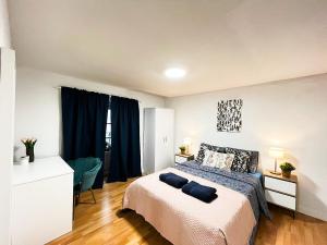 Ένα ή περισσότερα κρεβάτια σε δωμάτιο στο Madrid Rooms - Callao CH +12 φωτογραφίες