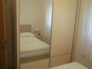 Posteľ alebo postele v izbe v ubytovaní Apartments Ivica