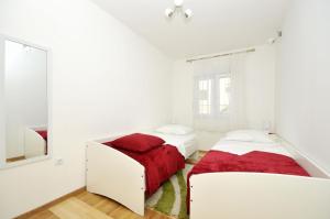 Posteľ alebo postele v izbe v ubytovaní Apartments Ivica