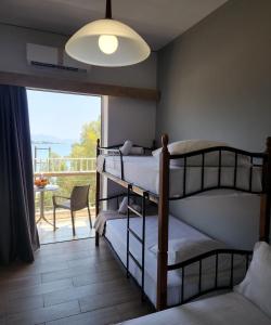 Postel nebo postele na pokoji v ubytování Stefania Hotel