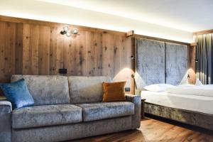 Postel nebo postele na pokoji v ubytování Hotel Antermoia