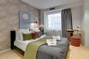 Posteľ alebo postele v izbe v ubytovaní Tartaczna City Center by Downtown Apartments