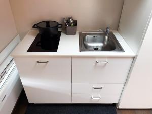 A kitchen or kitchenette at Le Stanze di Gianmarmo - Via di Mezzo