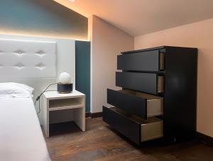A bed or beds in a room at Le Stanze di Gianmarmo - Via di Mezzo