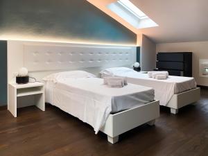 A bed or beds in a room at Le Stanze di Gianmarmo - Via di Mezzo
