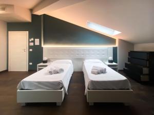 A bed or beds in a room at Le Stanze di Gianmarmo - Via di Mezzo