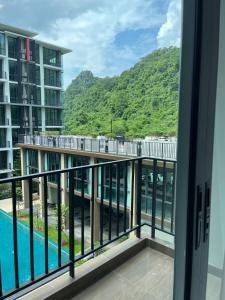 a view from the balcony of a condo with a view of a mountain at A303Forestkhaoyai in Ban Huai Sok Noi