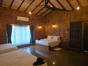 Postel nebo postele na pokoji v ubytování Ceylon wilpattu safaris & lodging
