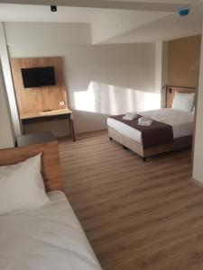 Ένα ή περισσότερα κρεβάτια σε δωμάτιο στο CENTER ROYAL PALACE HOTEl