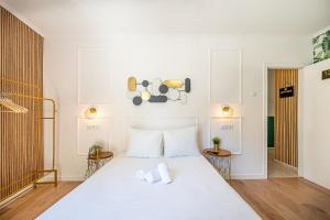 Cama ou camas em um quarto em Goa Square by Lisbon with Sintra