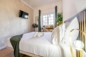 Cama ou camas em um quarto em Goa Square by Lisbon with Sintra mais 37 fotos