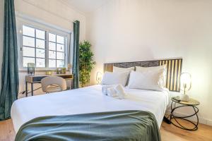 Cama ou camas em um quarto em Goa Square by Lisbon with Sintra