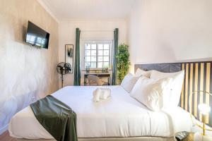 Cama ou camas em um quarto em Goa Square by Lisbon with Sintra
