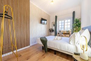 Cama ou camas em um quarto em Goa Square by Lisbon with Sintra