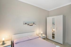 Ένα ή περισσότερα κρεβάτια σε δωμάτιο στο Exposito's Vacation Home