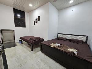 Letto o letti in una camera di Shri Mahaveer Residency