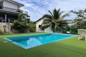 a swimming pool in the yard of a house at JZ Patong in Patong Beach