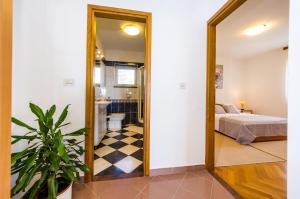 Postel nebo postele na pokoji v ubytování Apartments Cloe