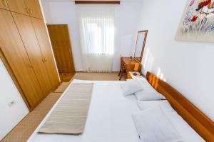 Postel nebo postele na pokoji v ubytování Apartments Cloe