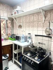 Kuchyň nebo kuchyňský kout v ubytování Makepe Villa