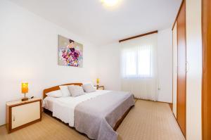 Postel nebo postele na pokoji v ubytování Apartments Cloe