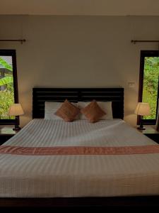 Postel nebo postele na pokoji v ubytování Sunda Resort