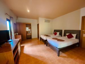 Postel nebo postele na pokoji v ubytování Sunda Resort