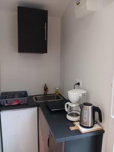 Kuchyň nebo kuchyňský kout v ubytování studio maisonette