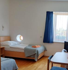Postel nebo postele na pokoji v ubytování Centrum Mariapoli