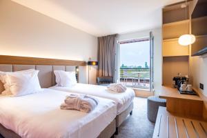 Postel nebo postele na pokoji v ubytování Hotel L'Europe + 37 fotografií